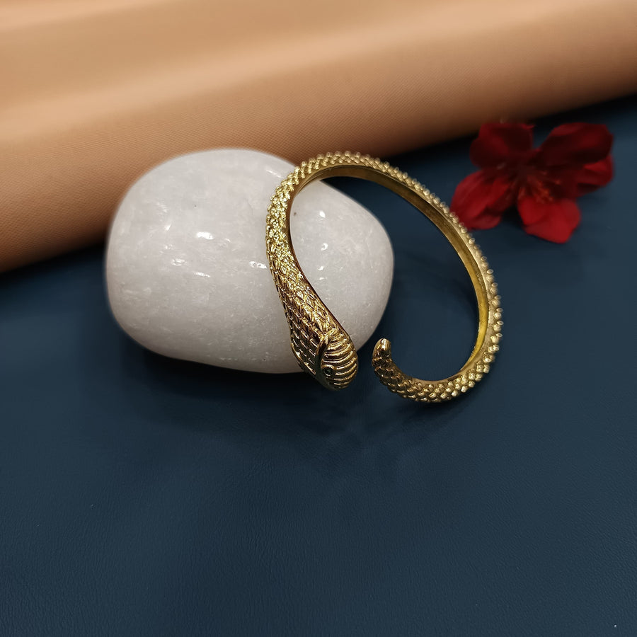 Chic golden bracelet with a sleek open bangle design.