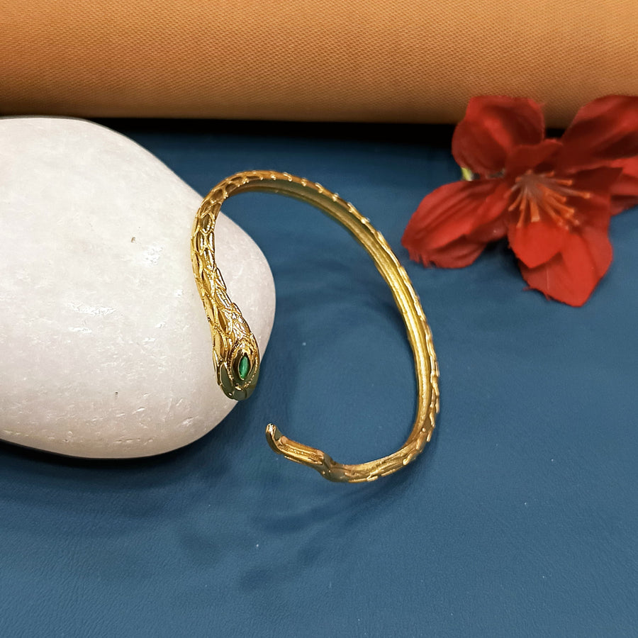 Elegant golden bracelet with a sleek, smooth finish.