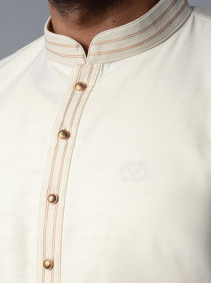 Make a statement at traditional gatherings with our exquisite cream kurta set.