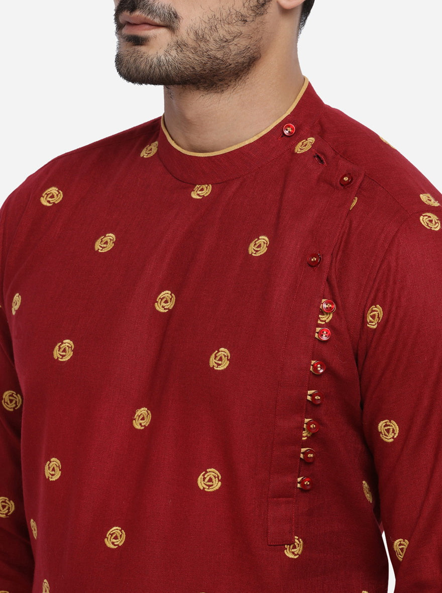 Elegant embroidered dark red kurta set, ideal for fashionable men.