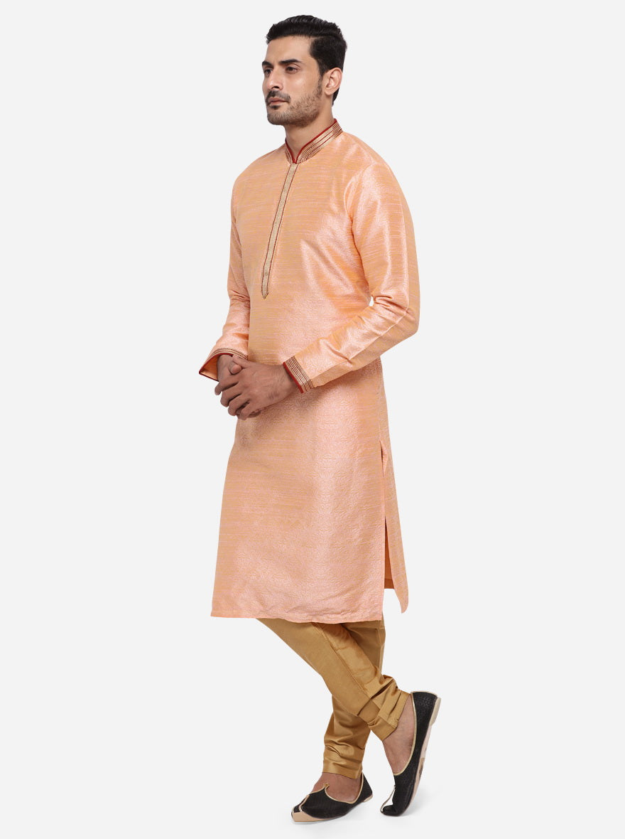 Shine at casual events in the USA with this stylish self-textured peach kurta pajama.