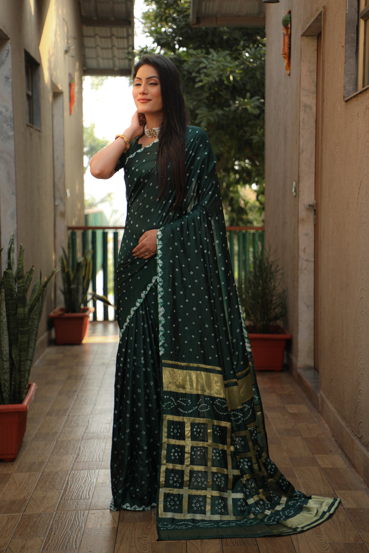 Beautiful teal-green Bandhej silk saree with original craft and checks pattern.