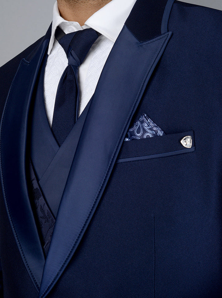 Navy blue tuxedo, designed for men, blending classic elegance with modern tailoring for special events.