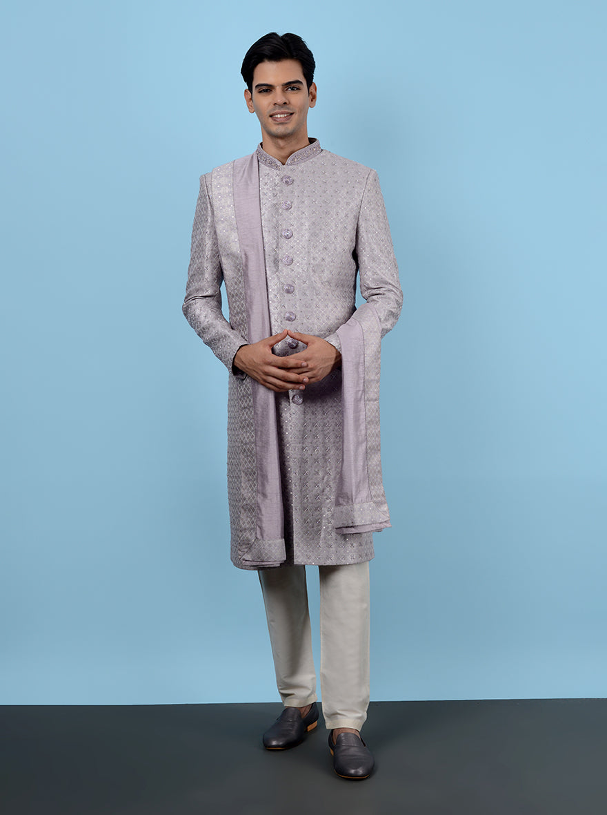 Shop the ultimate wedding sherwani! This lilac sherwani combines resham and sequins work.