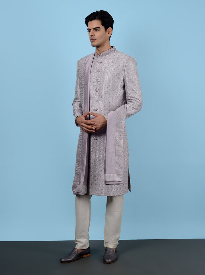 Elegant lilac sherwani for men, featuring beautiful resham and sequins work, perfect for grooms.