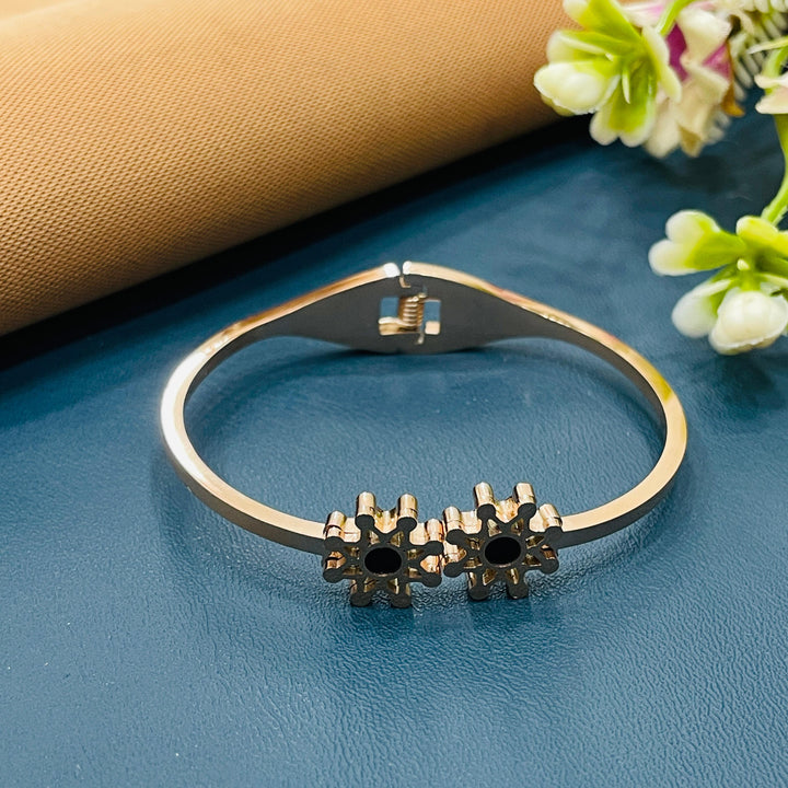 Elegant rose gold bracelet with a charm detail, a beautiful addition to any collection.