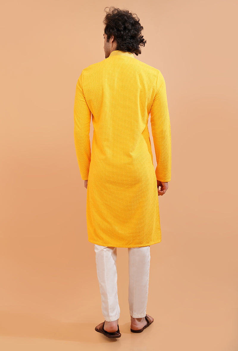 Men’s yellow silk kurta pajama, crafted with embroidery for USA haldi and festive events.