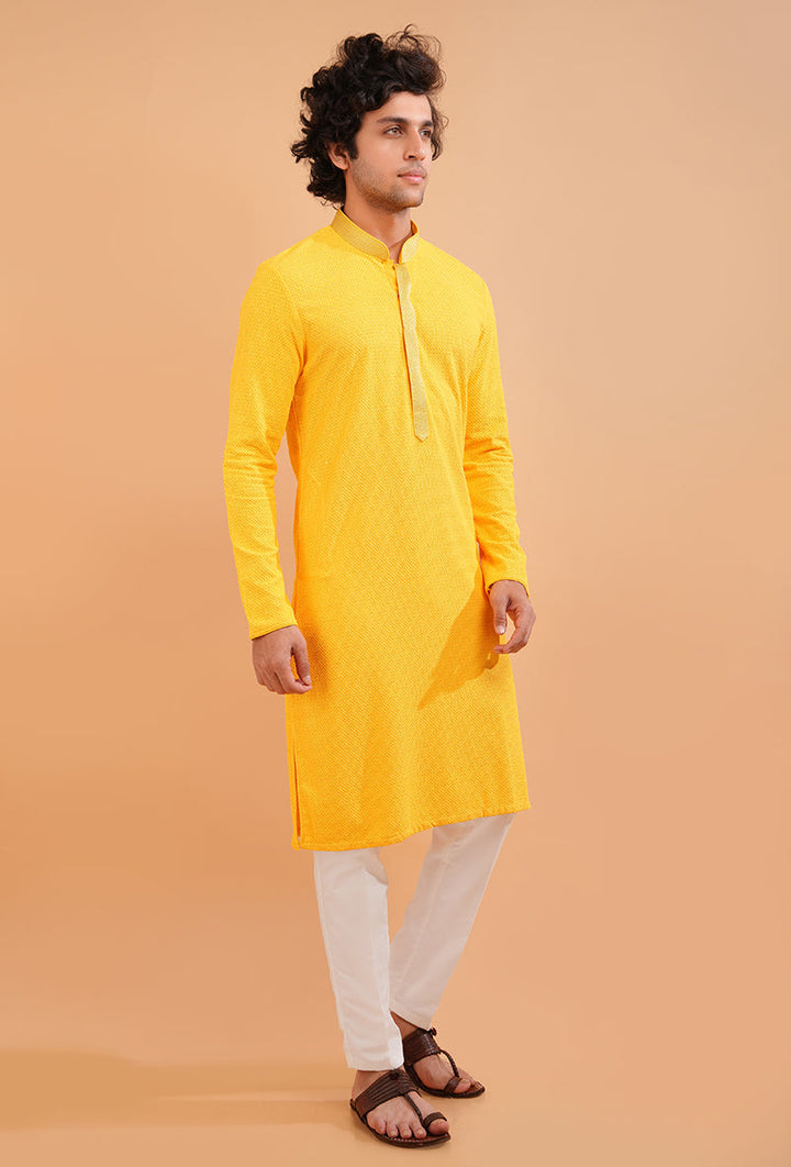 Elegant yellow kurta pajama with embroidery, a USA men’s favorite for haldi occasions.