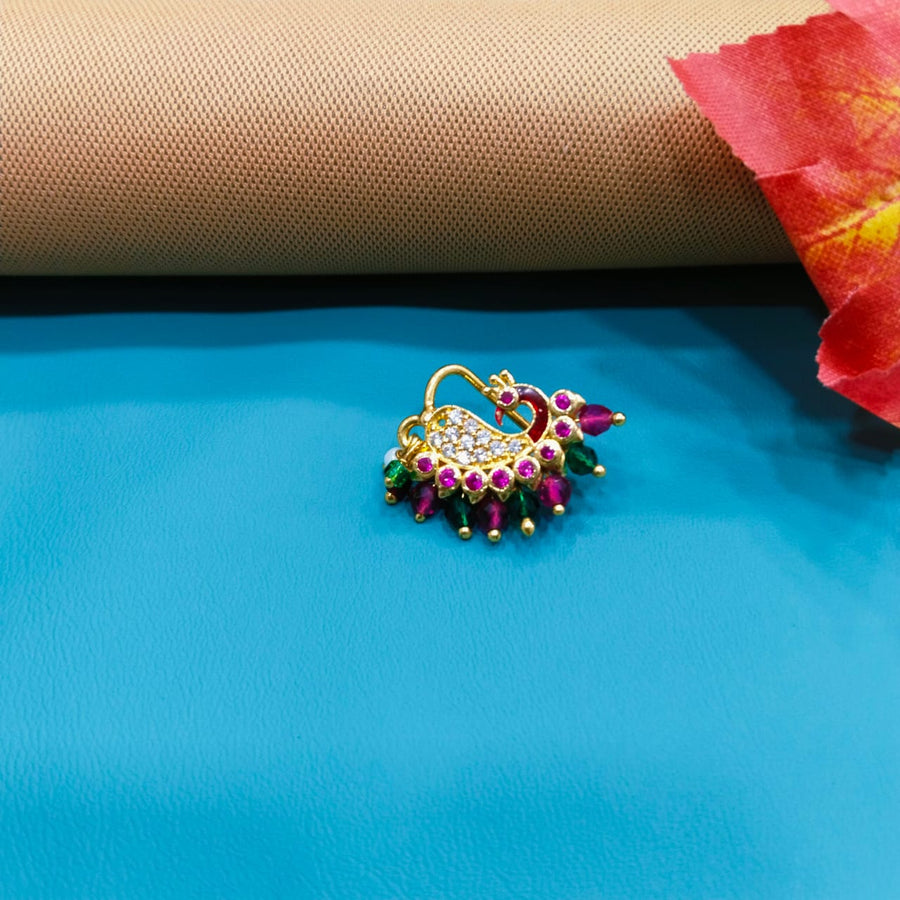 "Beautiful kundan nose ring with intricate work, ideal for celebrations."