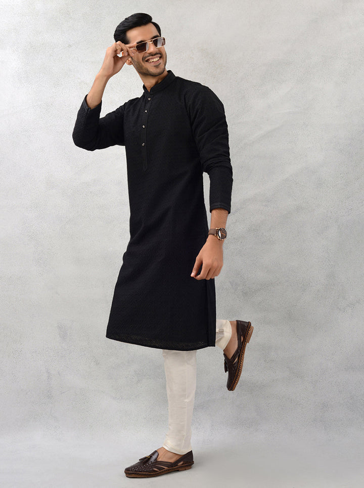 Luxurious black kurta featuring exquisite embroidery details.