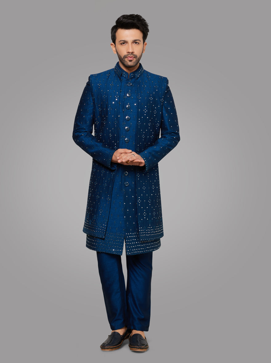 Blending traditional craftsmanship with modern flair, this Dark Blue outfit is ideal for celebrations.