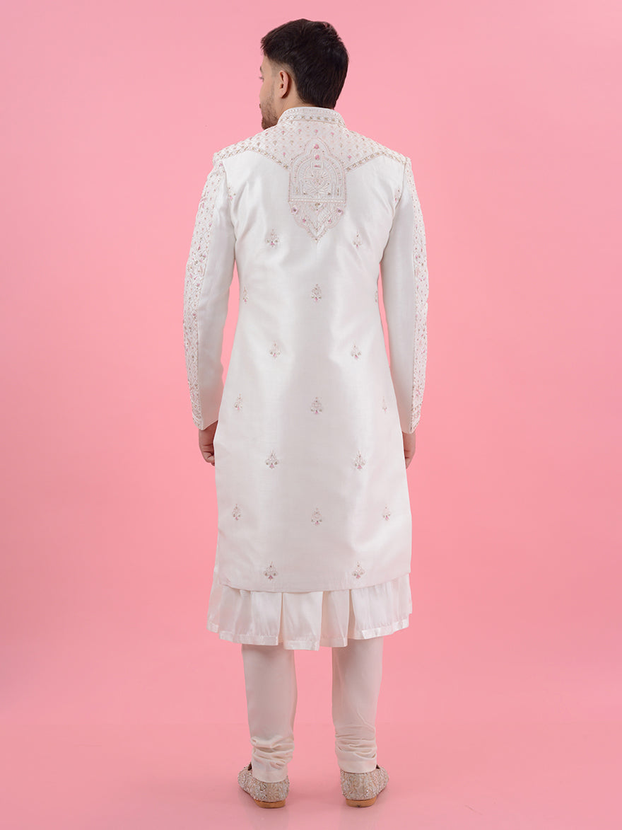 Celebrate your special day in the USA with this Cream Silk Blend Embroidered Sherwani, showcasing intricate embroidery and a comfortable fit that beautifully elevates your wedding style.