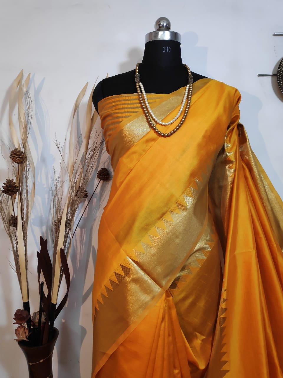 Exquisite mustard yellow Indian saree with detailed zari border, pallu, and matching blouse, ideal for weddings or festive wear.