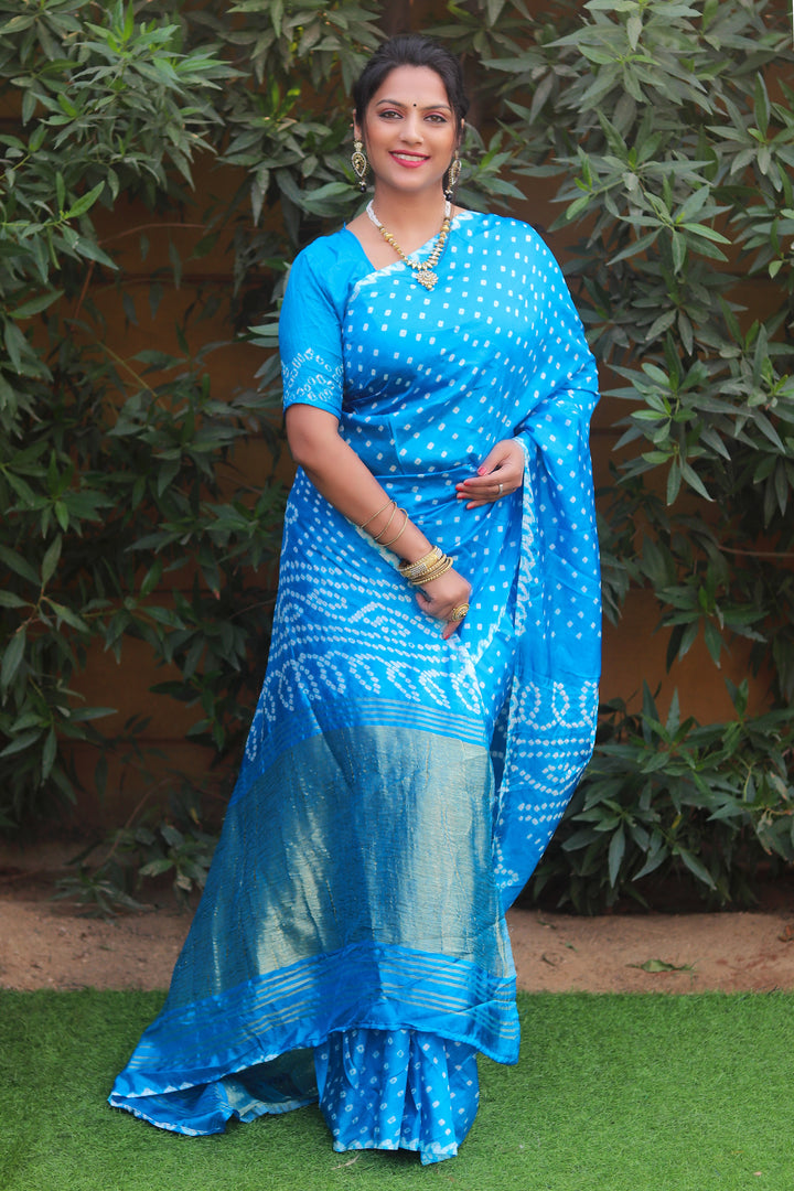 Graceful sky blue pure Bandhej silk saree with intricate Lagdi Patta and rich pallu for a festive look.