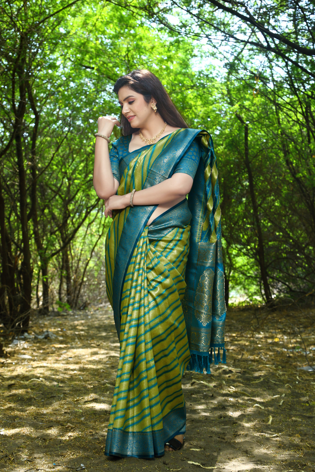 Light-Green Leheriya Silk Saree with Zari woven design and elegant border, perfect for weddings and parties.