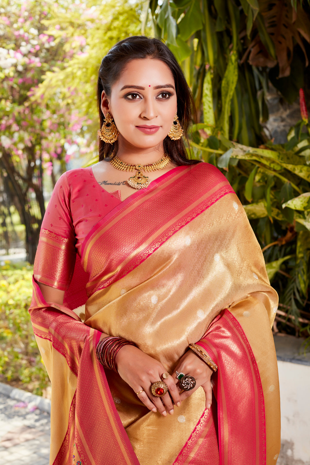 Traditional green tissue silk saree with vibrant pallu and contrast blouse, perfect for festivals.