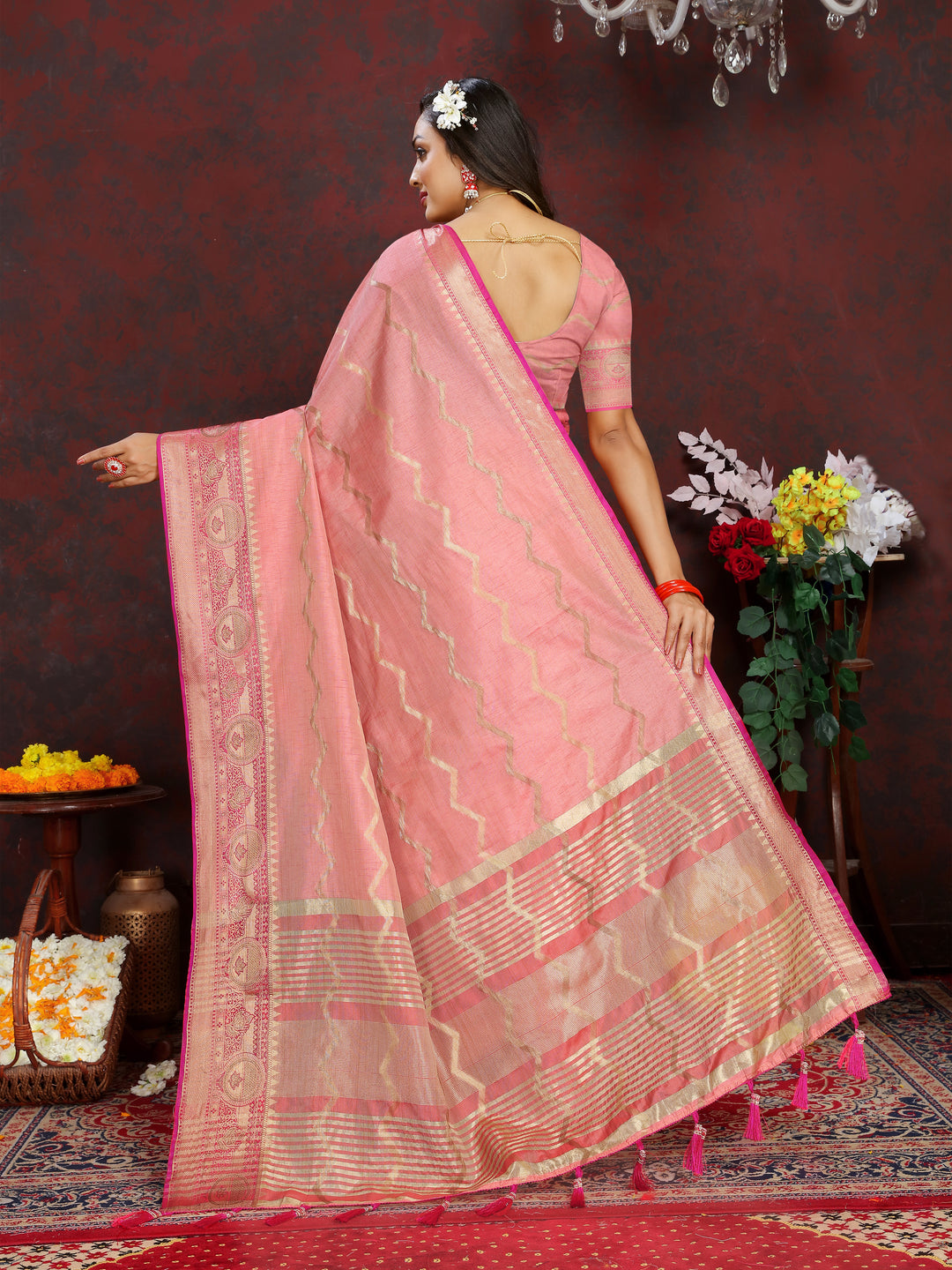 Peach silk saree with beautiful zari weaving, perfect for weddings and formal events.