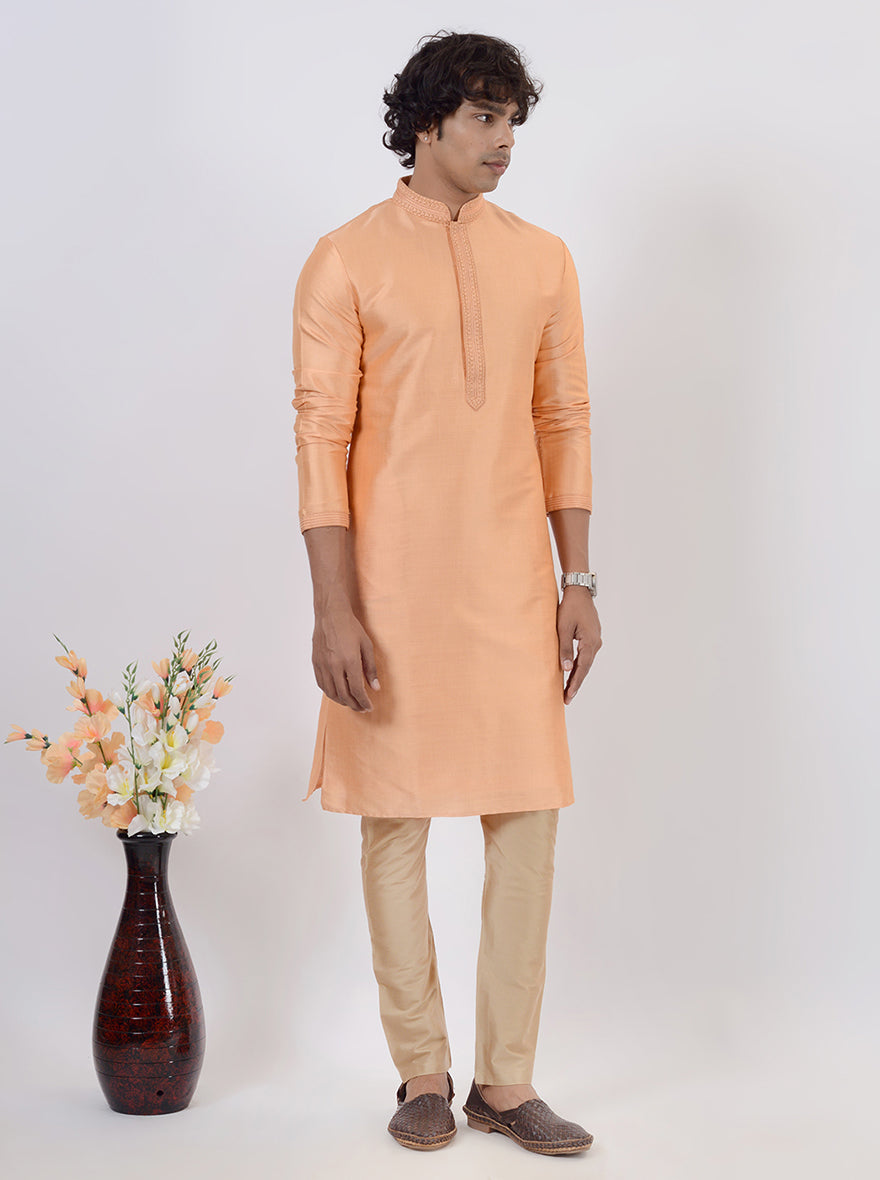 Stylish peach silk kurta set for men, ideal for weddings and festive occasions.