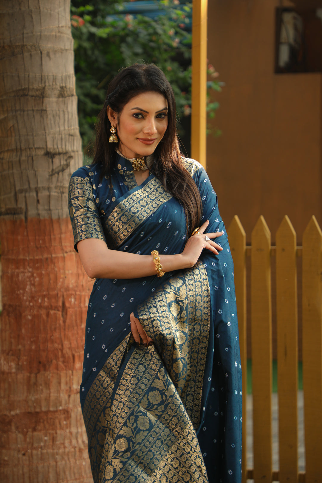 Gorgeous pink Bandhej Kanjivaram silk saree with intricate zari weaving and a beautiful pallu, perfect for festive celebrations.