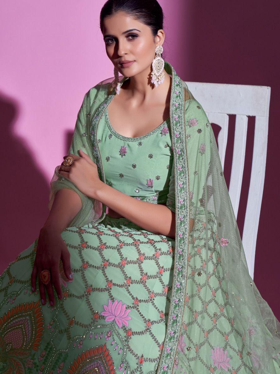 Stunning pista green georgette wedding lehenga with stone and thread work.