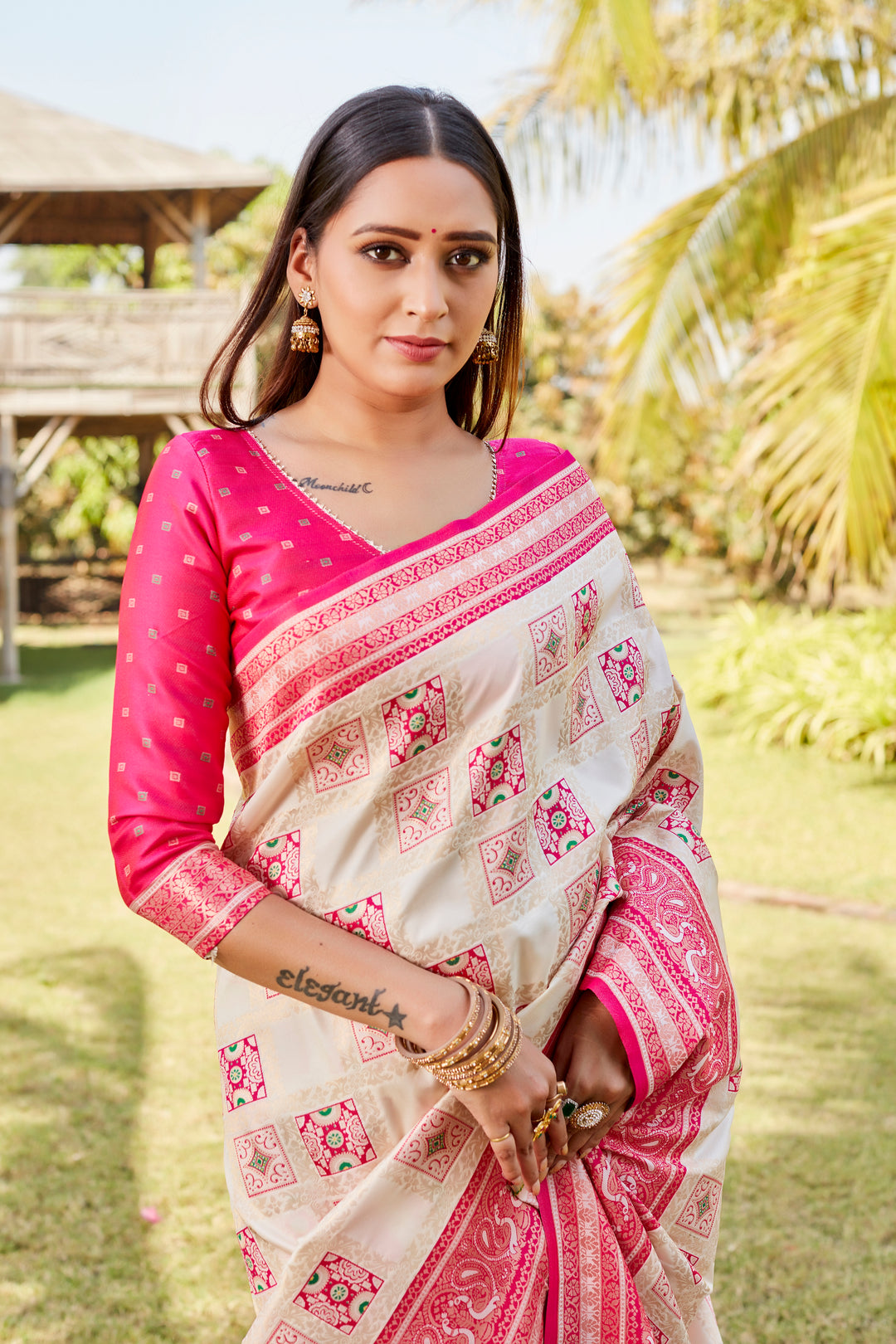 Soft pink Kanjivaram soft silk saree with intricate designer borders and luxurious finish.