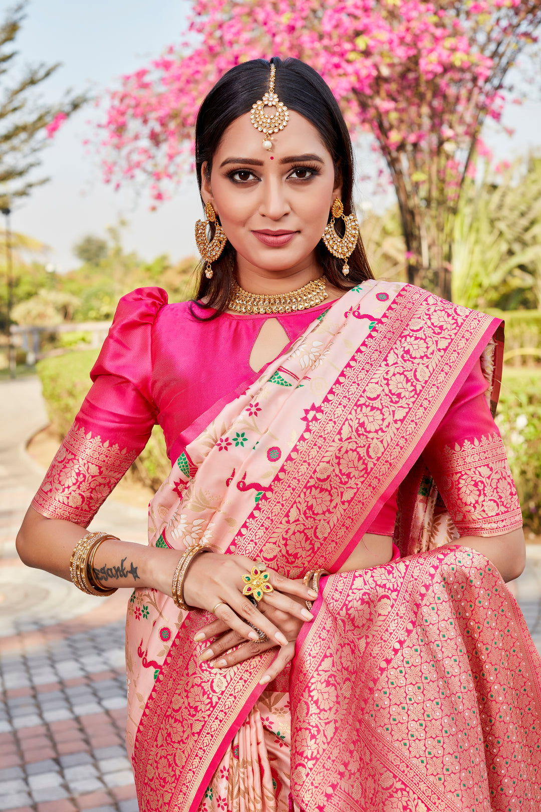 Baby Pink Kanjivaram Soft Silk Saree with rich traditional patterns and modern style for weddings.