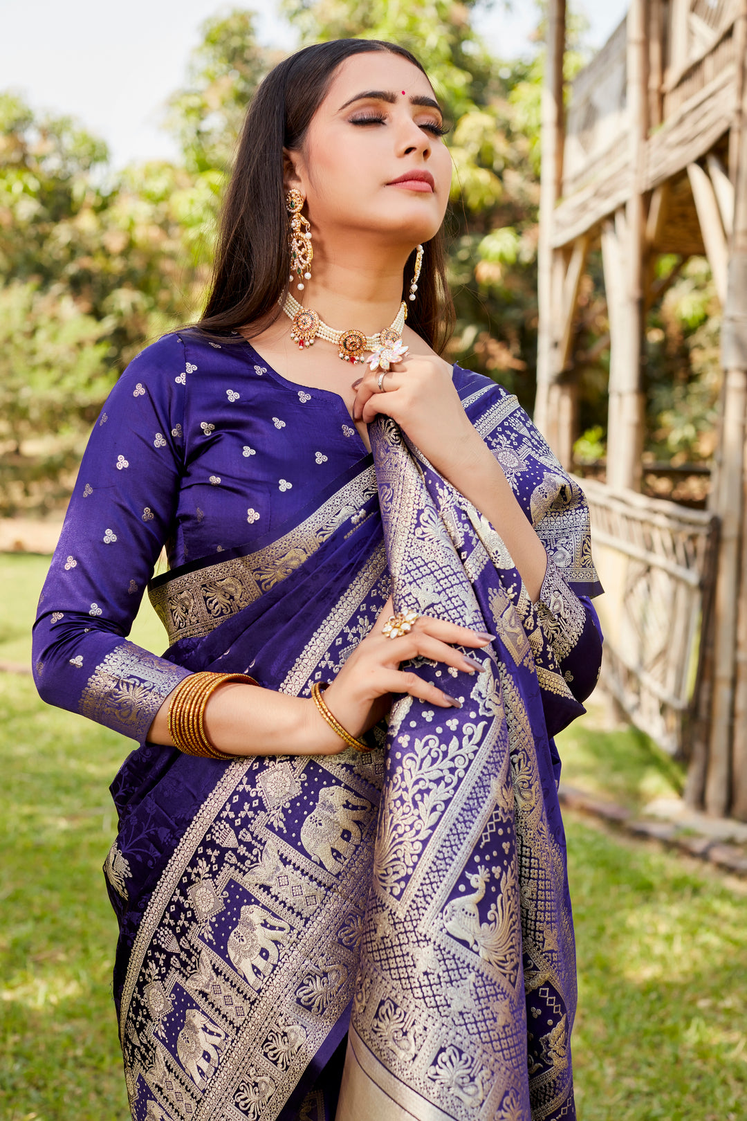 Elegant navy satin Kanjivaram saree with traditional elephant border, perfect for weddings and cultural events.