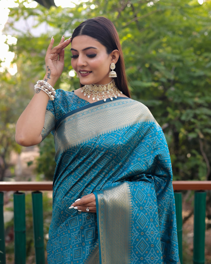 Beautiful blue Bandhej Patola silk saree showcasing intricate designs and vibrant zari weaving, perfect for special occasions.