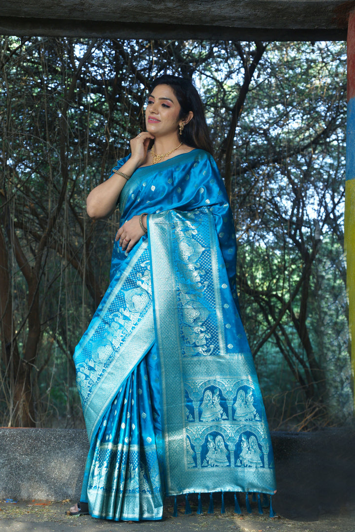 Classic blue satin silk saree with a stunning Kanjivaram weaving design, ideal for adding grandeur to your wardrobe.