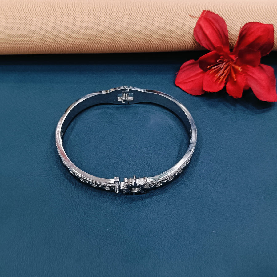 Sophisticated silver bracelet with a polished finish, suitable for any outfit.