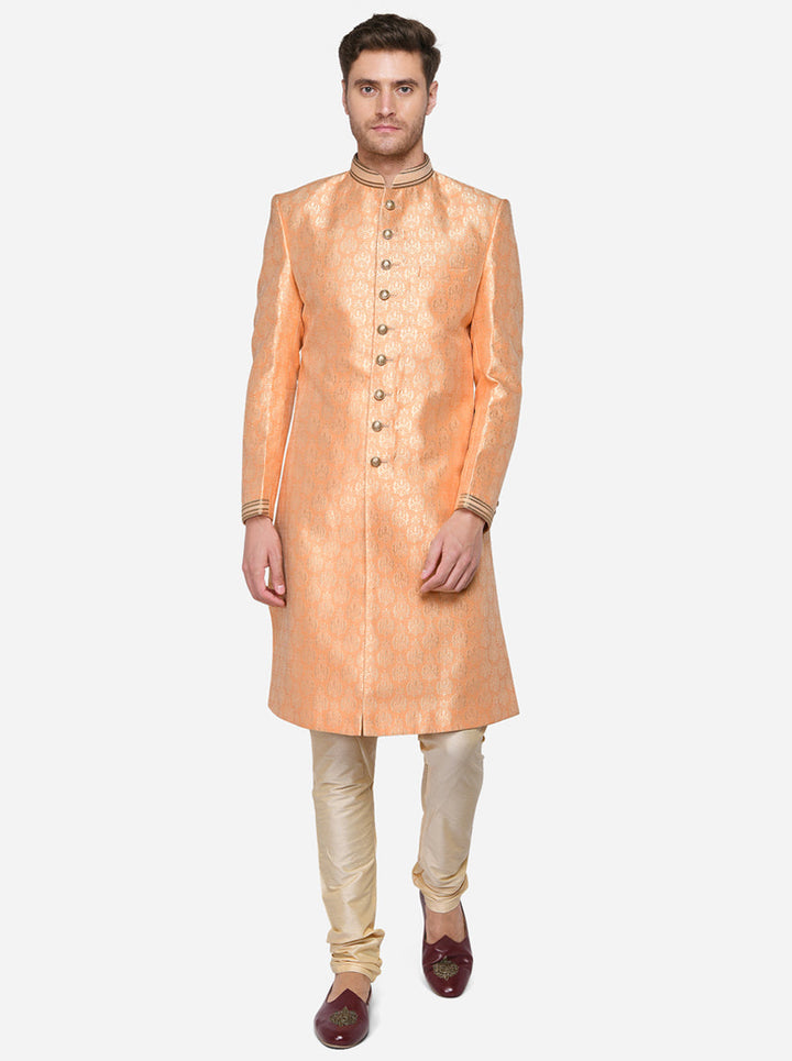 Complete your ensemble with our luxurious orange Sherwani, designed to elevate your attire for any occasion.