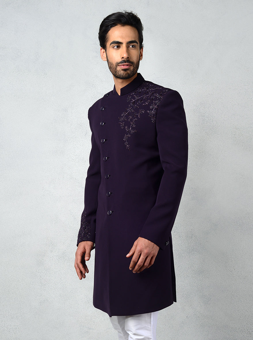 Stylish purple Indo-Western kurta with metallic buttons and embroidered sleeves.