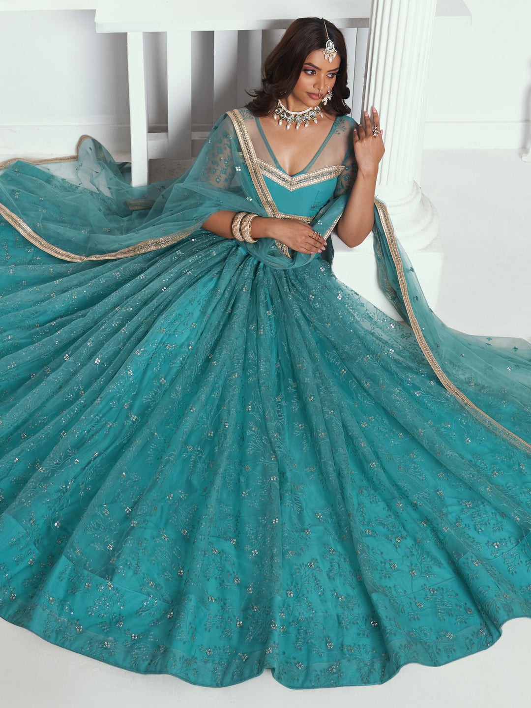 Beautiful Teal Green Embroidered Net Wedding Wear Lehenga Choli