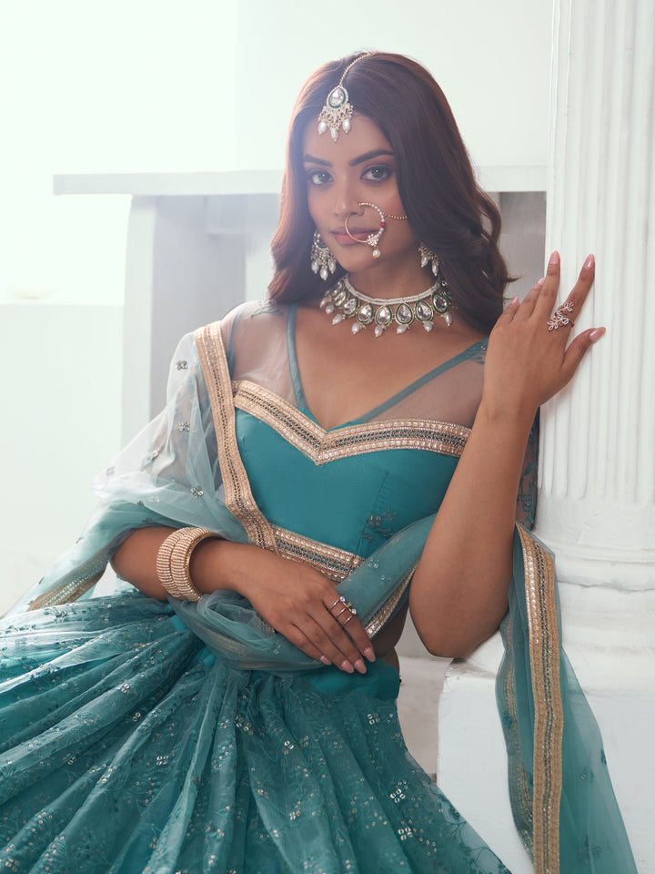 Beautiful Teal Green Embroidered Net Wedding Wear Lehenga Choli