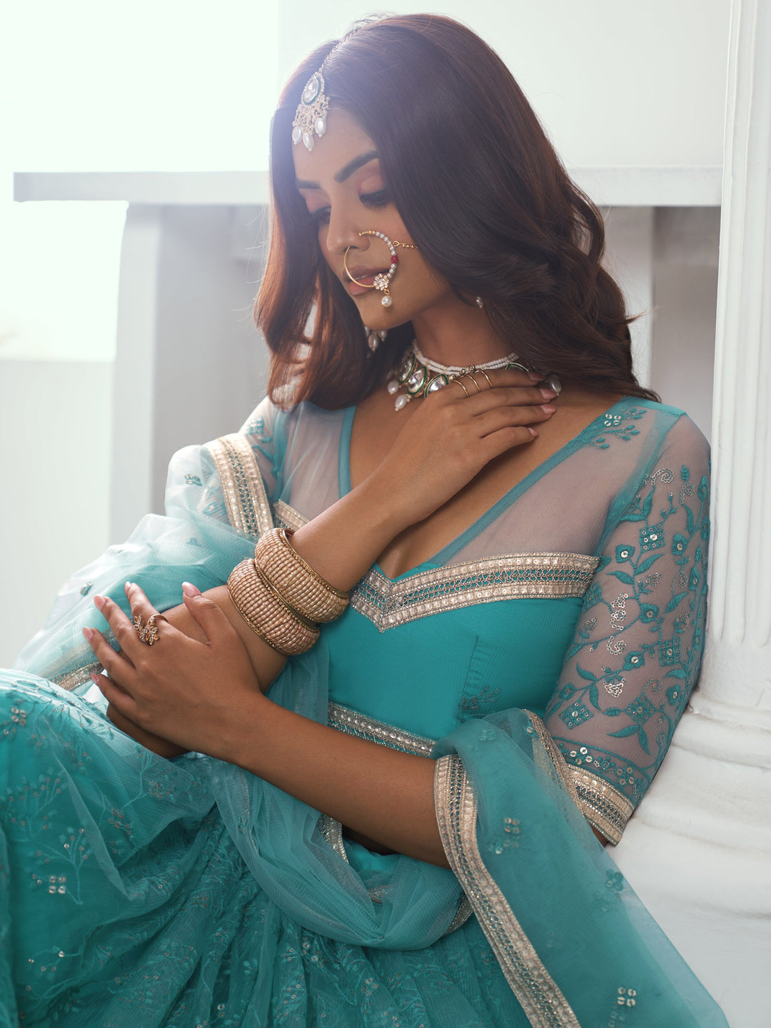 Beautiful Teal Green Embroidered Net Wedding Wear Lehenga Choli