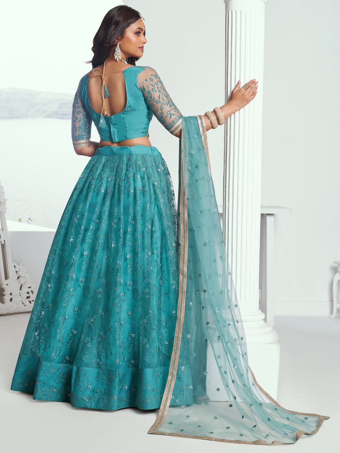 Beautiful Teal Green Embroidered Net Wedding Wear Lehenga Choli