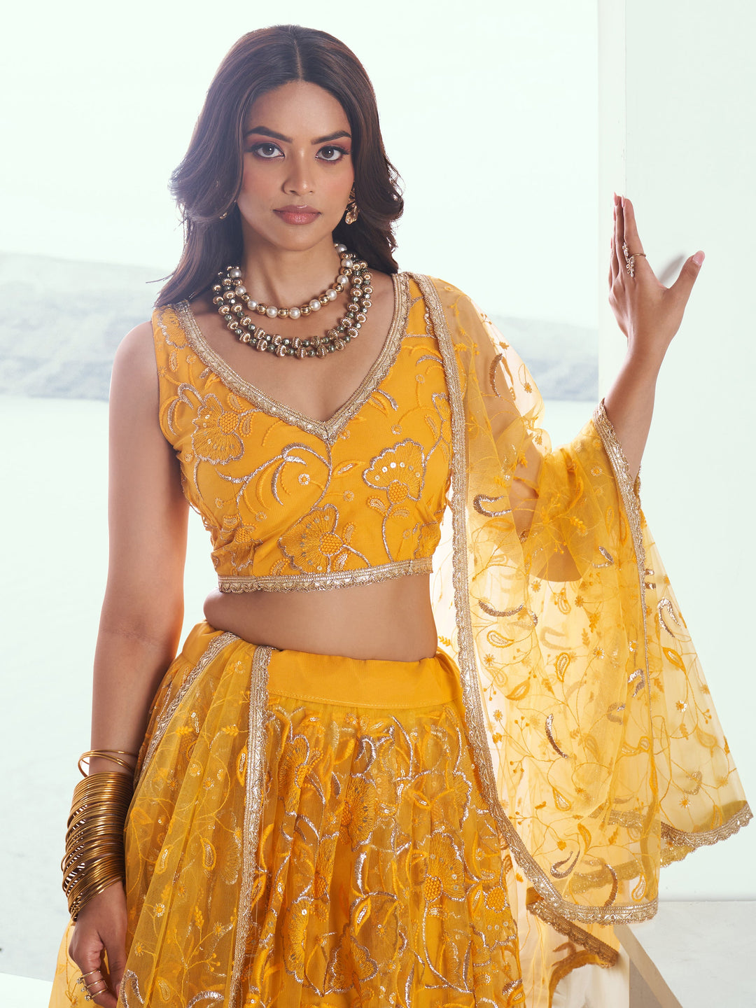 Attractive Yellow Embroidered Net Wedding Lehenga Choli With Dupatta