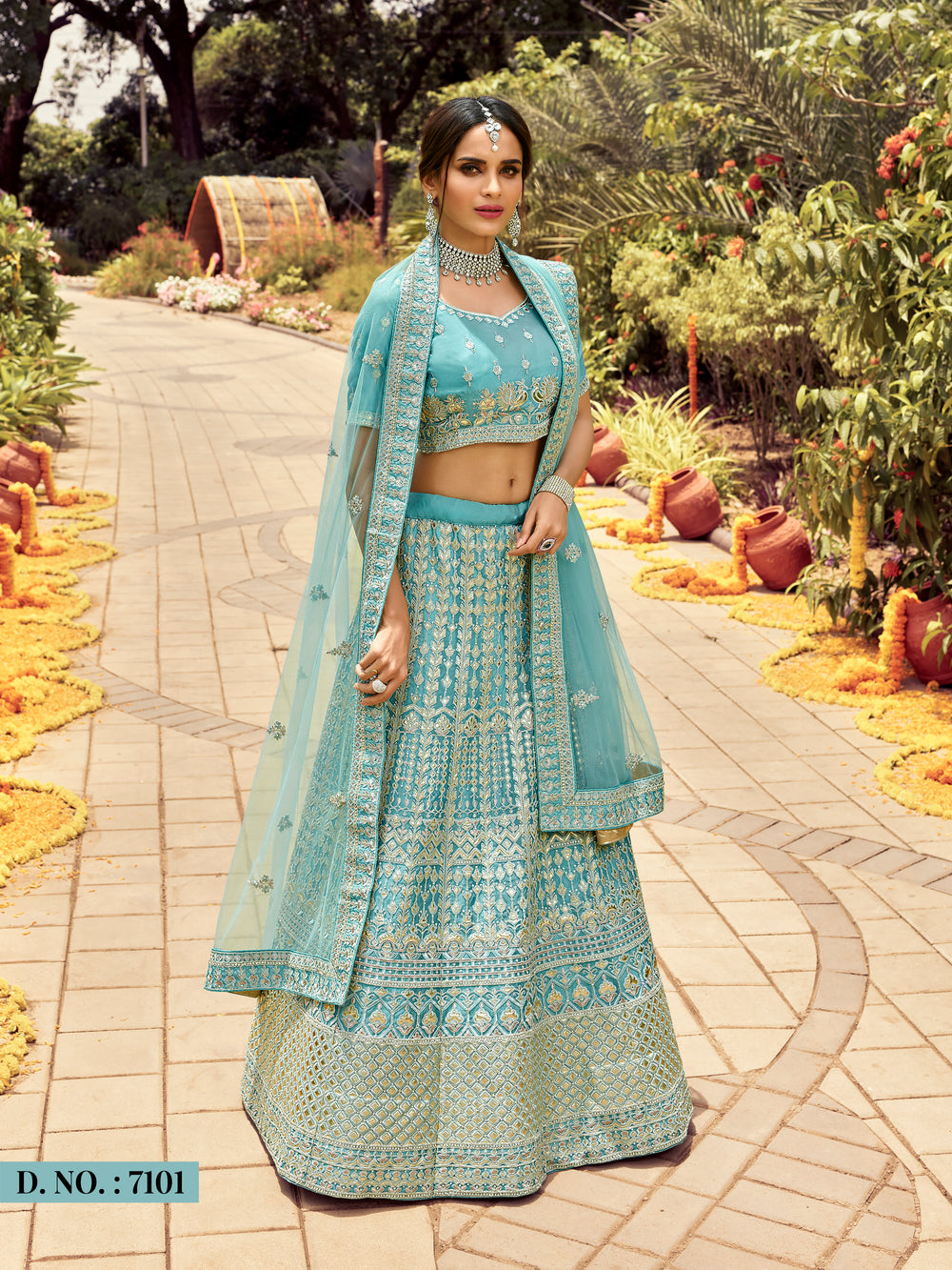 Elegant sky blue A-line lehenga choli crafted in organza, adorned with dazzling zari, gota, and resham embroidery, paired with a soft net dupatta.