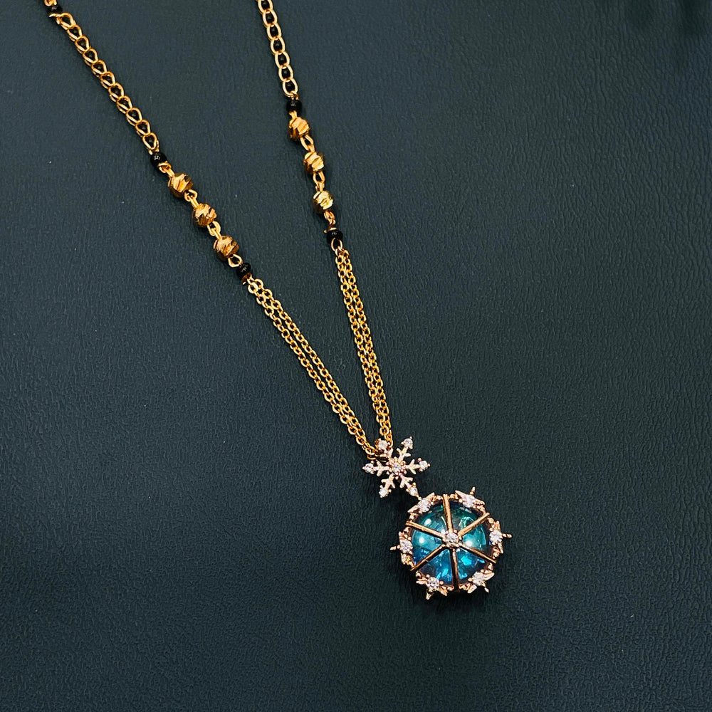 Traditional mangalsutra necklace in black and gold, crafted in gold-plated alloy, elegant style.