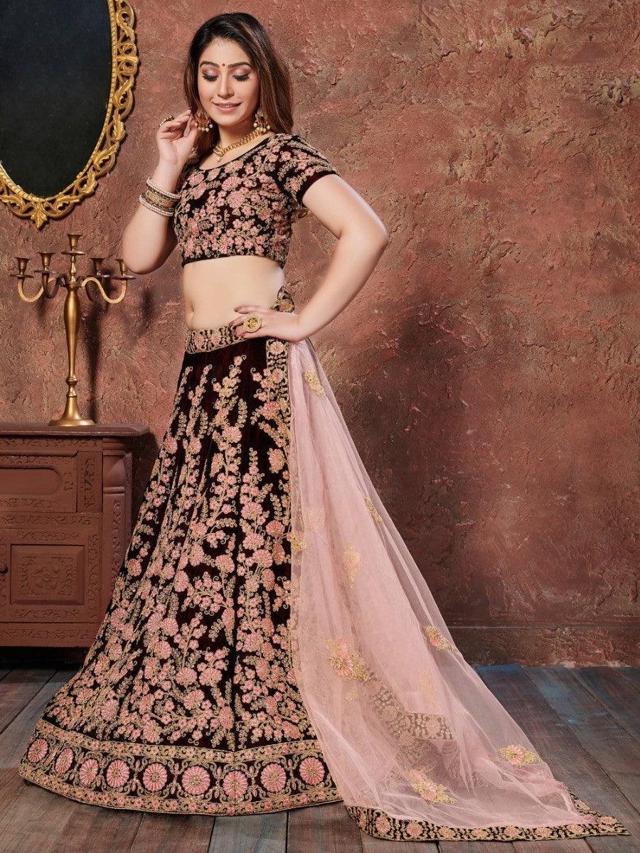 Party wear lehenga in maroon velvet with intricate thread and sequin work