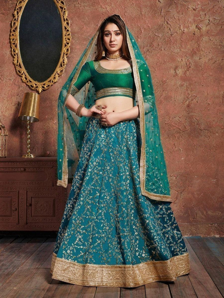 Teal green art silk bridal lehenga with sequins and dori embroidery