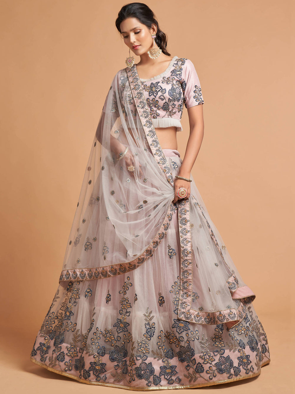 Designer grey lehenga choli with can-can inside and embroidered detailing for a sophisticated look.