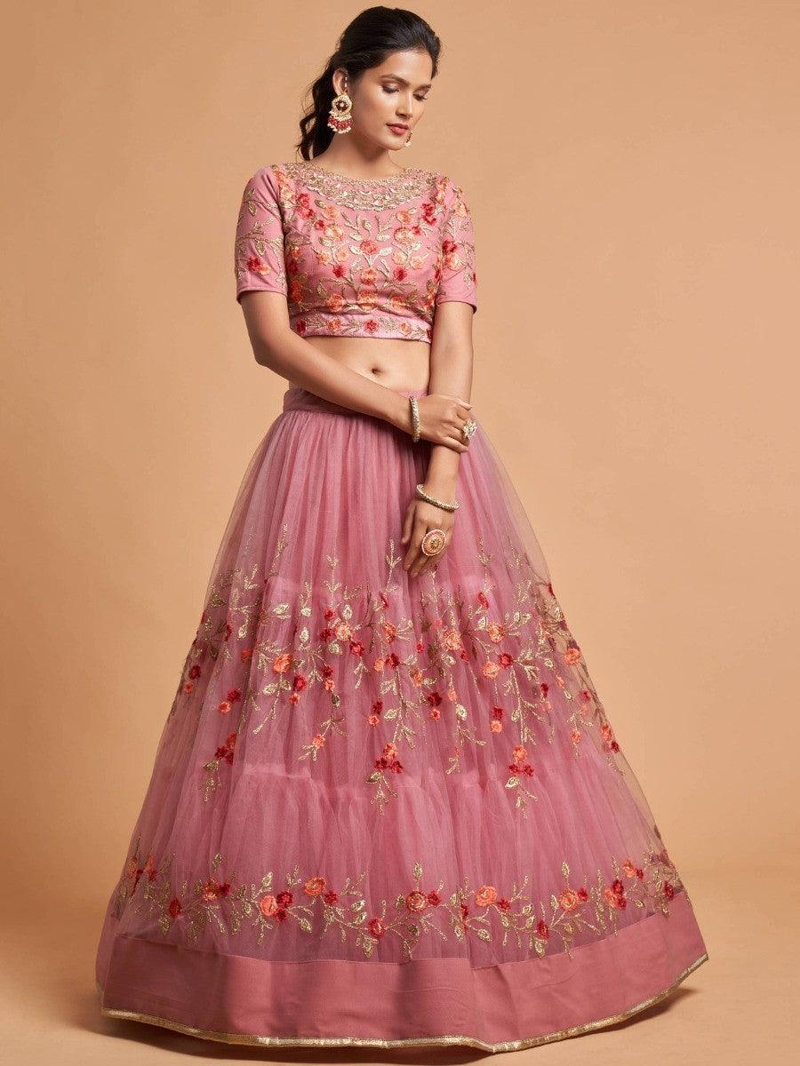 Designer dusty pink lehenga choli with embroidered details and attached can-can for a graceful look.