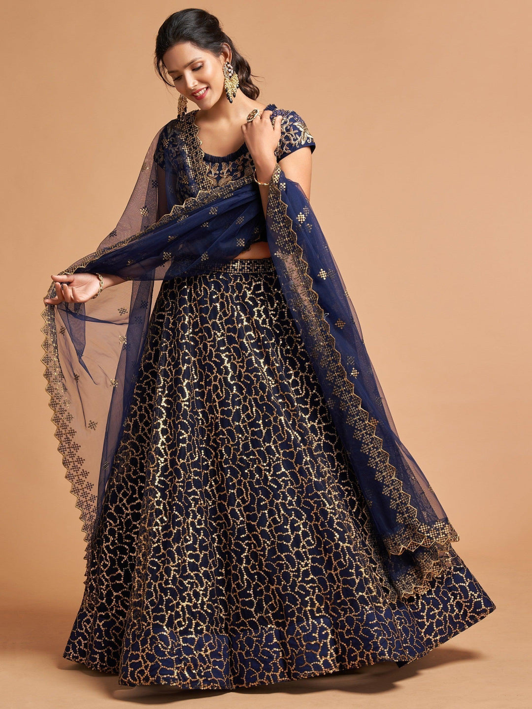 Designer navy blue lehenga choli with a soft net blouse and dupatta.