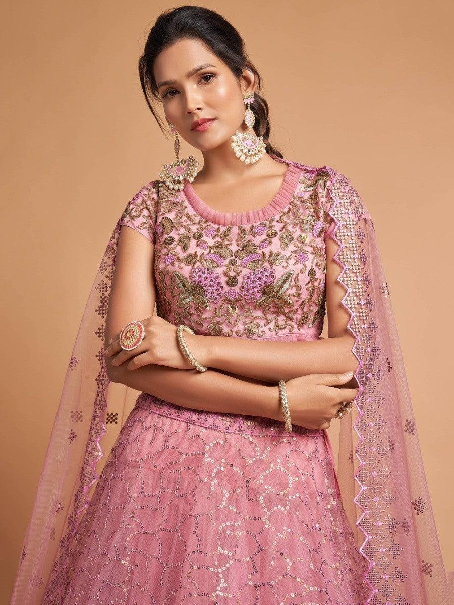 Elegant blush pink lehenga with intricate embroidery details.