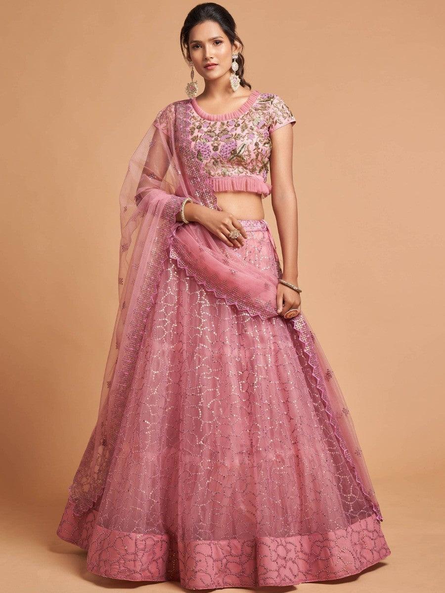 Blush pink lehenga with thread and zari embroidery for weddings.