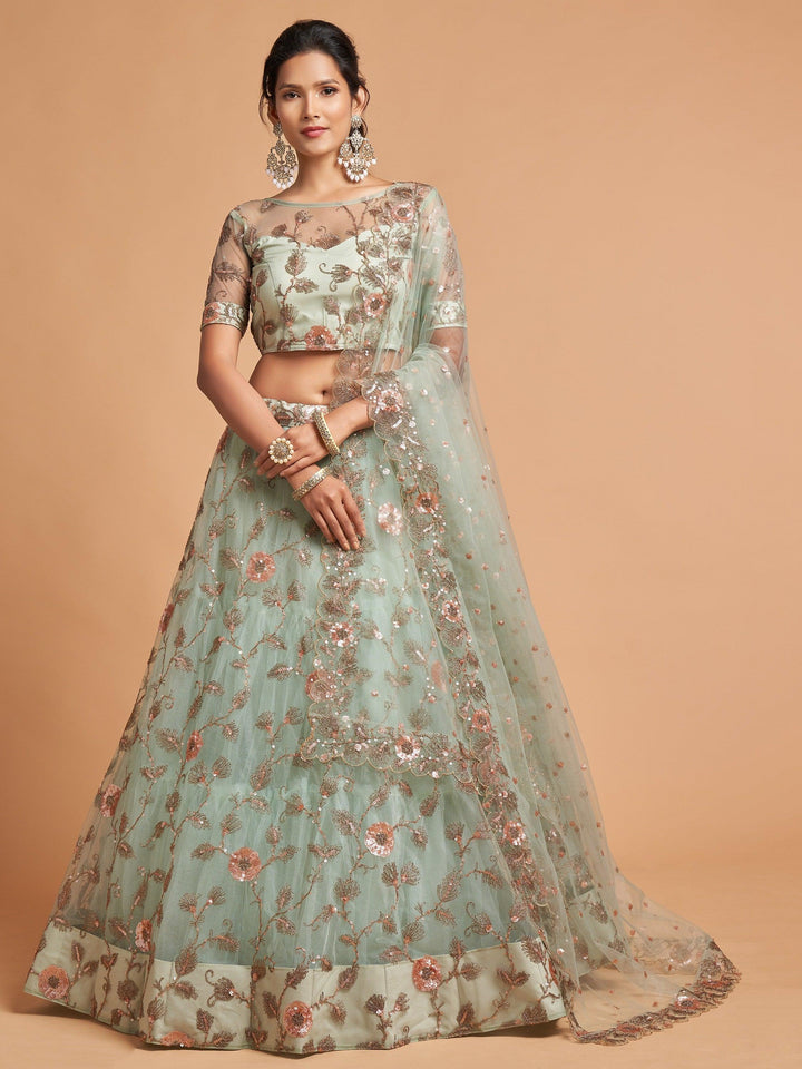 Pista green lehenga with detailed embroidery for engagements.