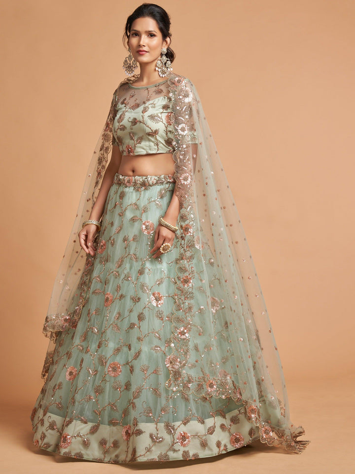 Designer pista green lehenga choli with matching blouse and dupatta.