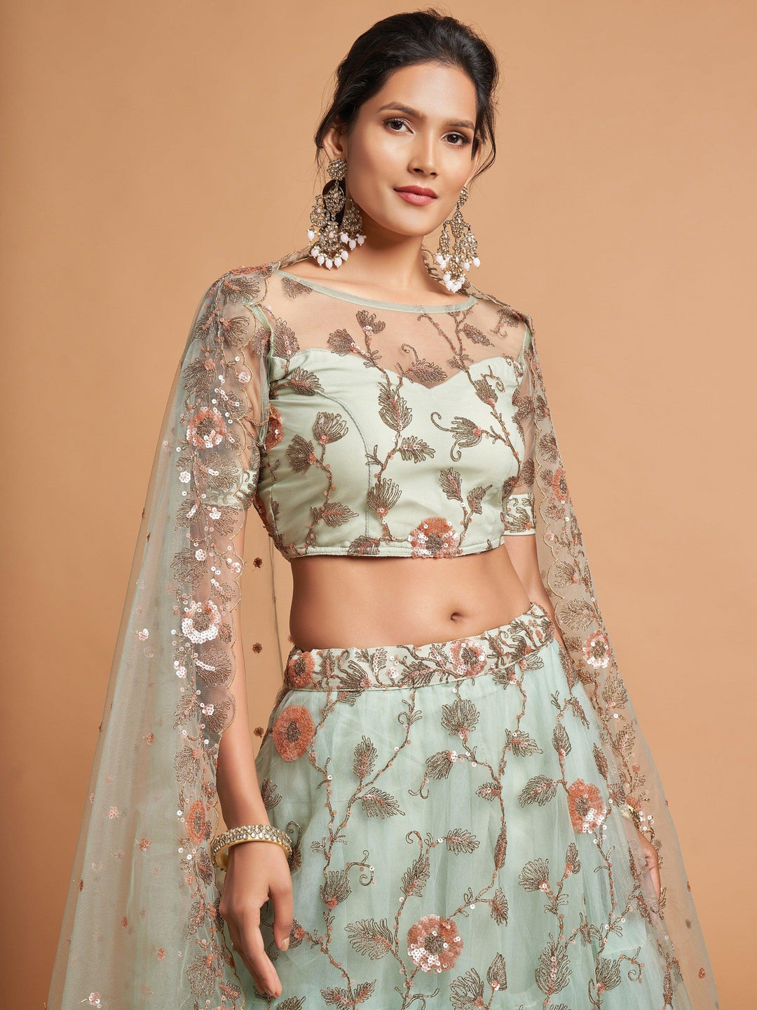 Semi-stitched pista green lehenga customizable up to 42 inches.