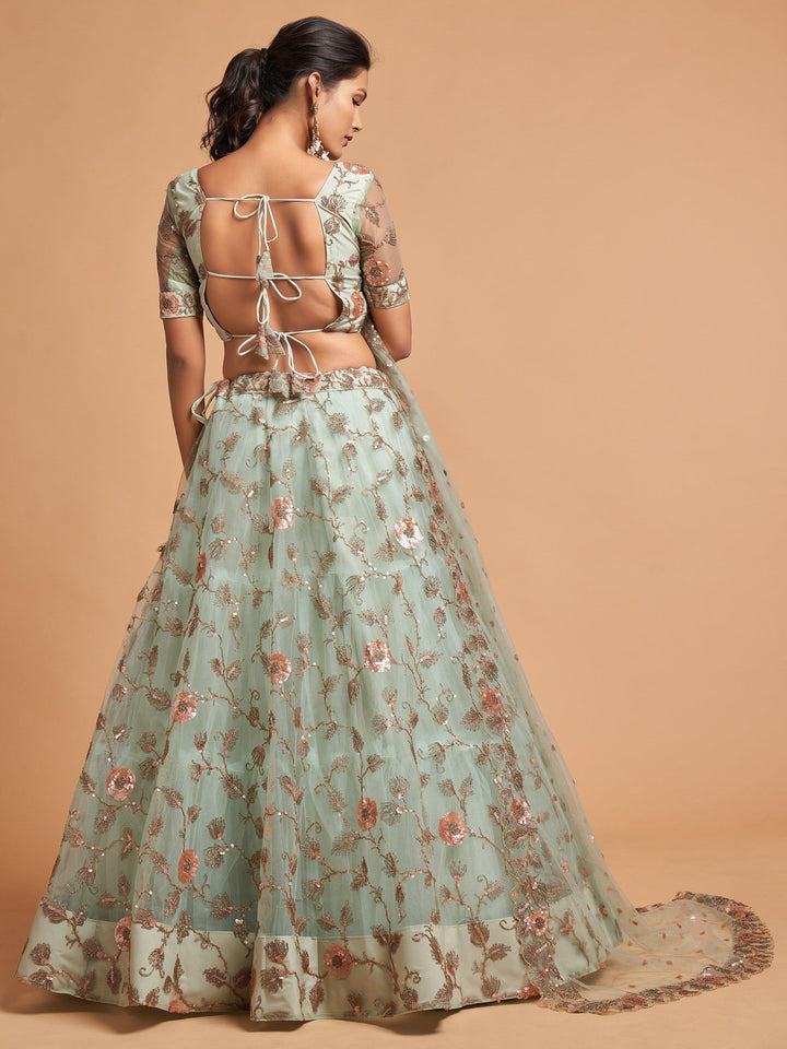 Pista green wedding wear lehenga with zari and thread embroidery.